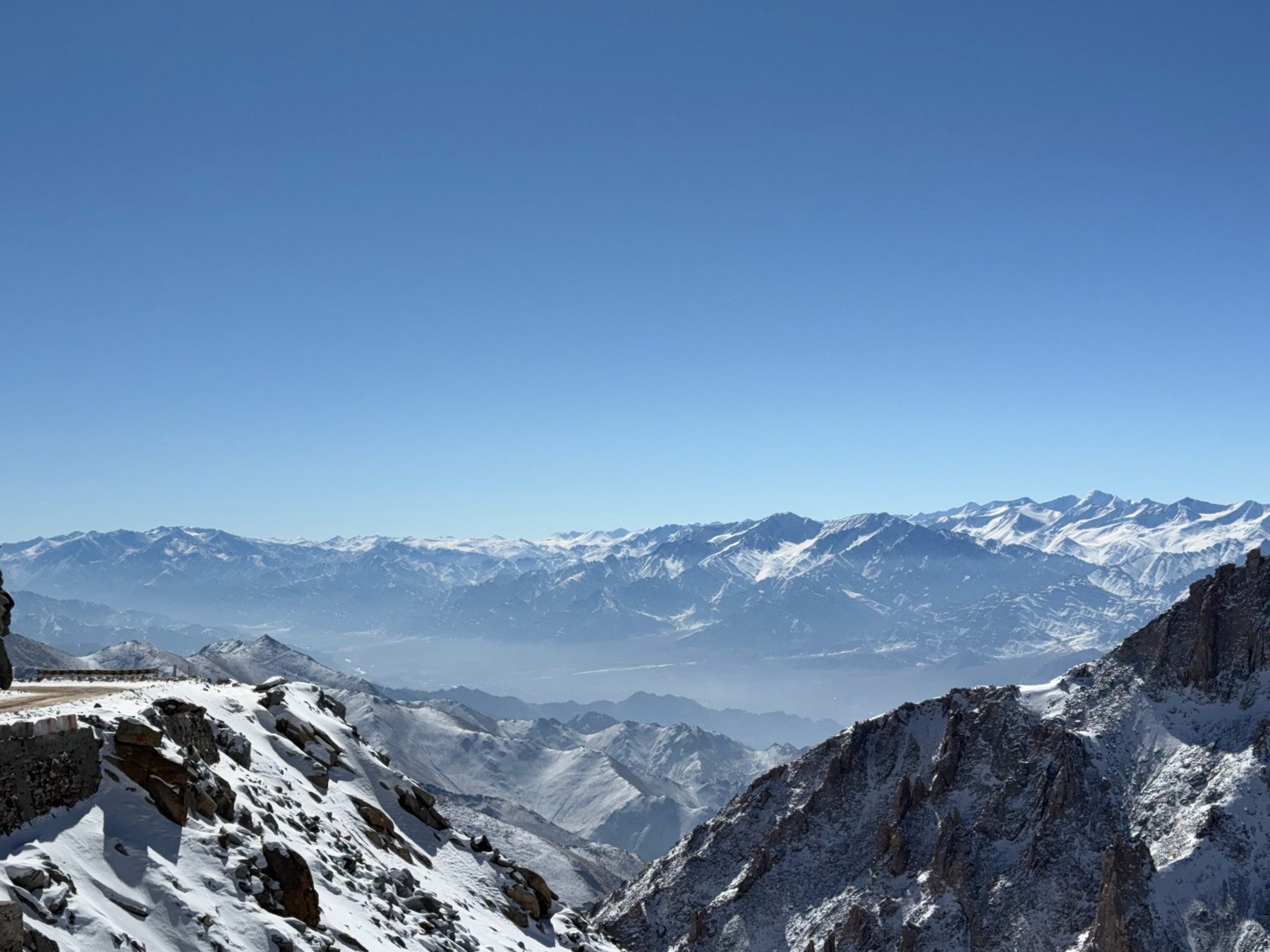Snow-covered Ladakh range under a clear sky